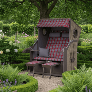 Strandkorb Trendy Twin View mit Bullaugen PE nature grey Dessin 472 rot grau kariert im Garten mit Fußstützen und Kissen