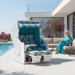 Strandkorb Classic 2-Sitzer Weiß Ocean Sonnenpartner Dessin 717 türkis, komfortabler Strandkorb am Pool mit Frau, die liest.