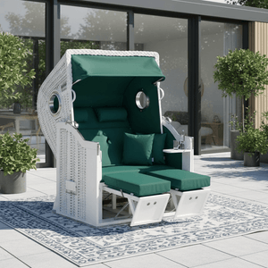 Strandkorb Sonnenpartner Classic weißes Geflecht mit moosgrünen Polstern auf Terrasse vor moderner Glasfassade