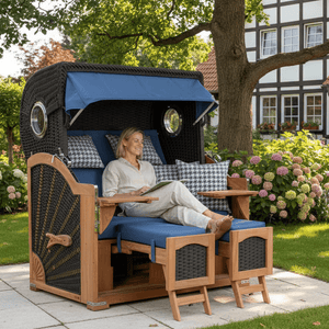 Strandkorb deVries Aruba XL Rope anthrazit Dessin 509 mit Fußstützen im Garten, Frau entspannt im komfortablen Strandkorb